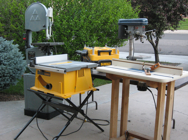 power tools including band saw, planer, table saw and router table